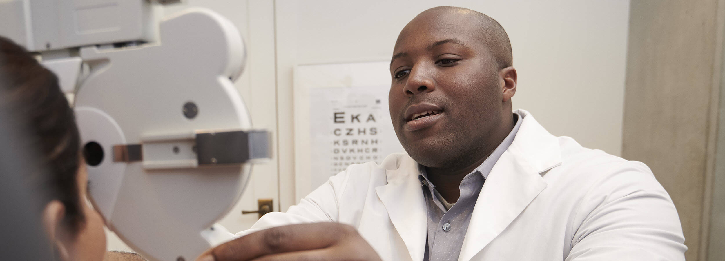 Optometrist performing eye exam